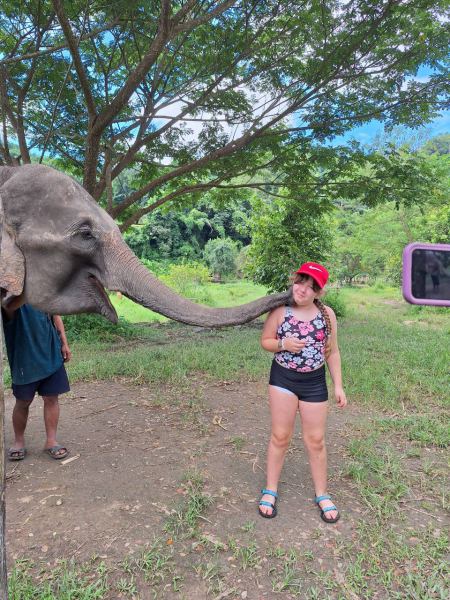 An elephant gently nuzzling a young guest - lifeonwheel.com