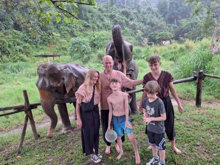 Family photo between two friendly elephants - lifeonwheel.com