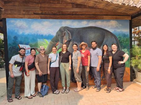 The group photo with the painted elephant backdrop - lifeonwheel.com
