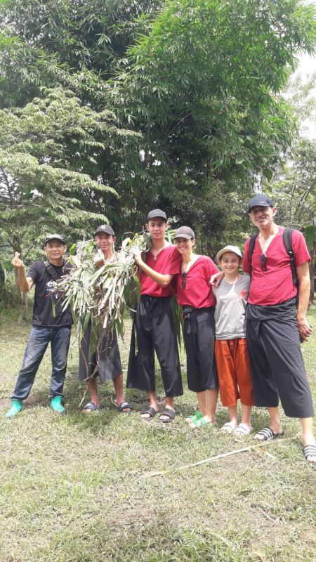 A family group with fresh cut fodder for the elephants - lifeonwheel.com