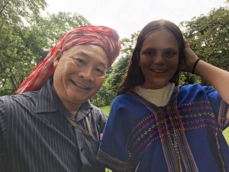 A guide in a red headscarf posing with a young guest - lifeonwheel.com