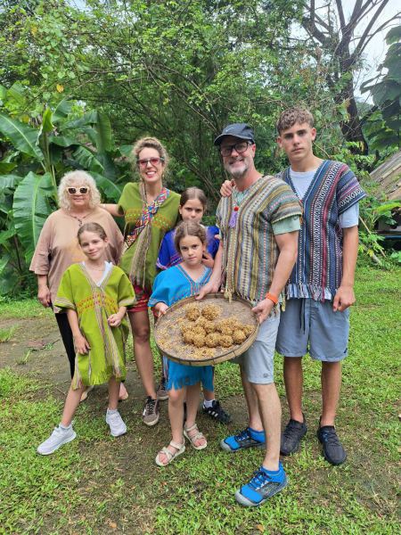 The family holding a tray of homemade elephant medicine balls - lifeonwheel.com